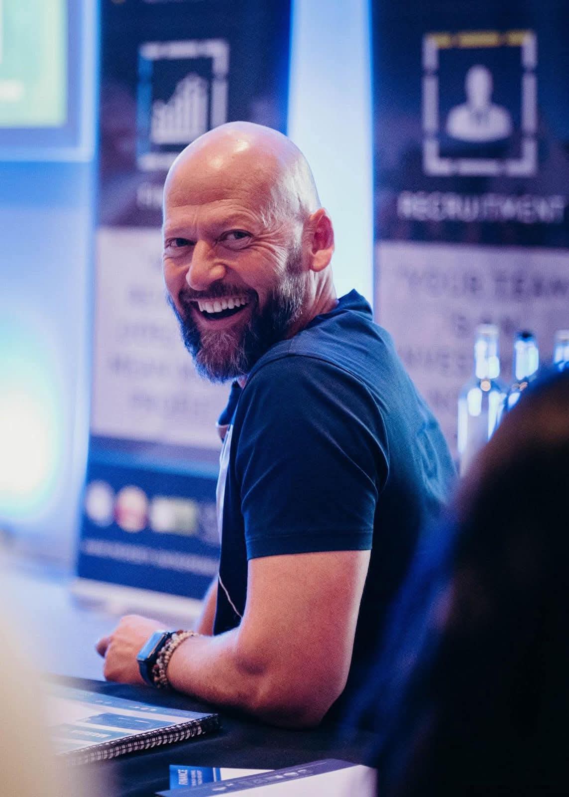 James Wyatt, coach for Coach and Stay by Soulful Stays in Darlington, smiling at a business event